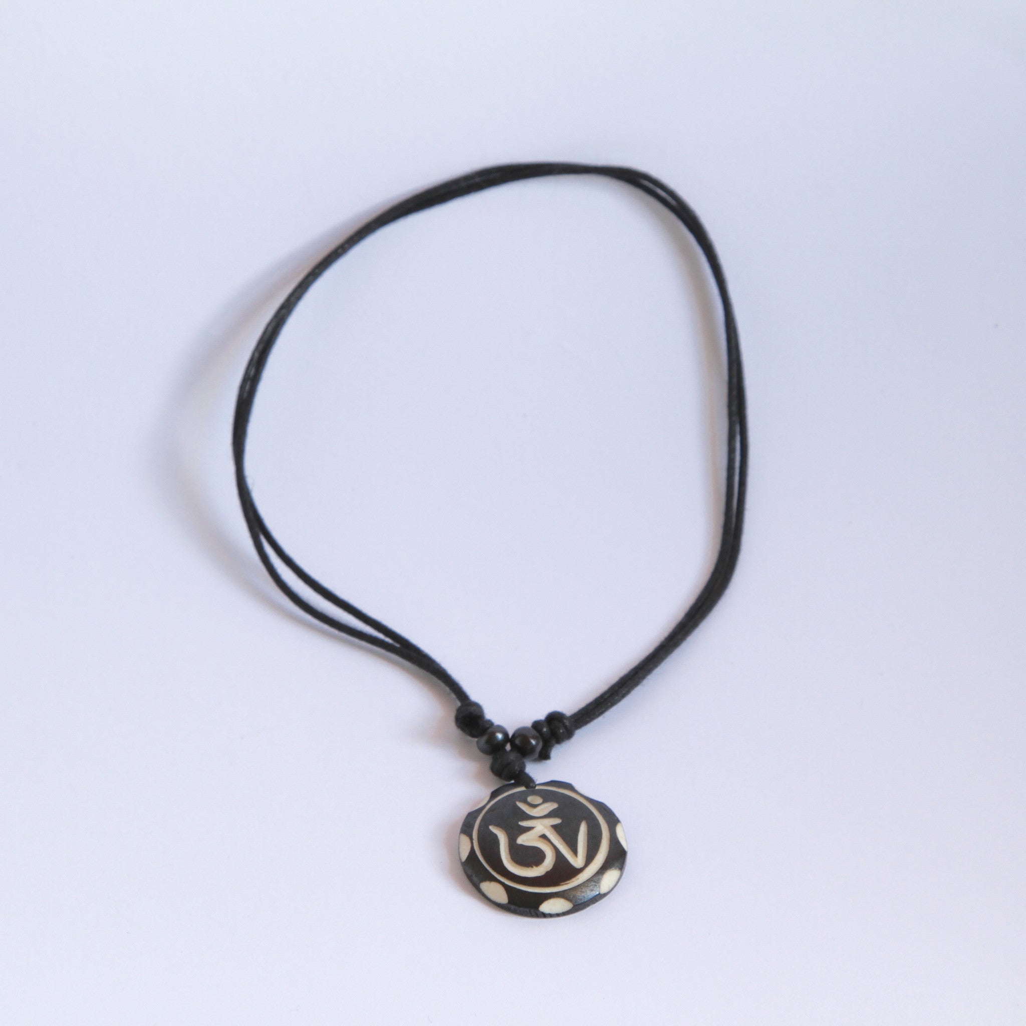 Tibetan OM - Round Pendant with Leather Loop